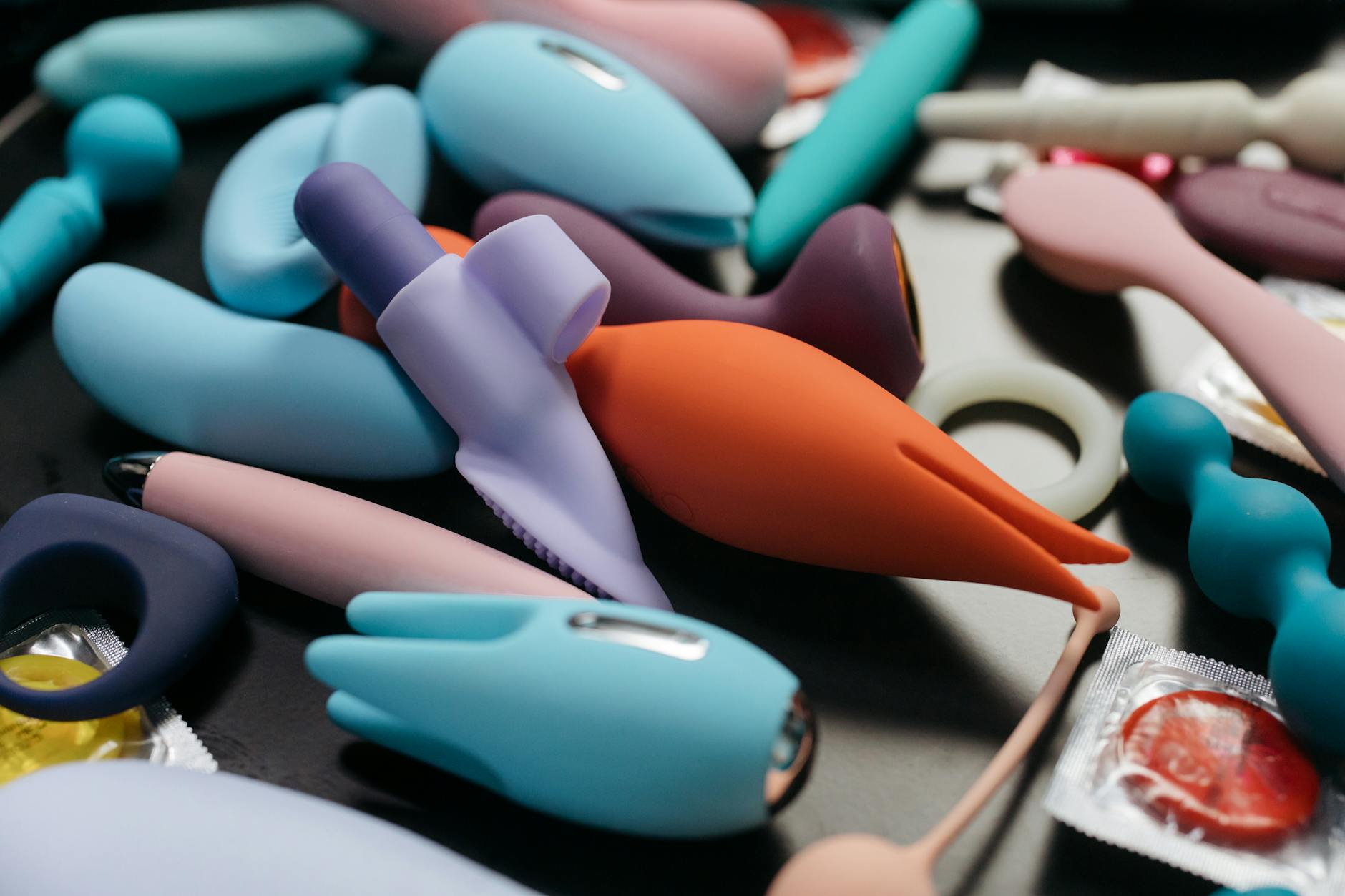 Vibrant selection of clitoral vibrators displayed together, representing diverse pleasure tools