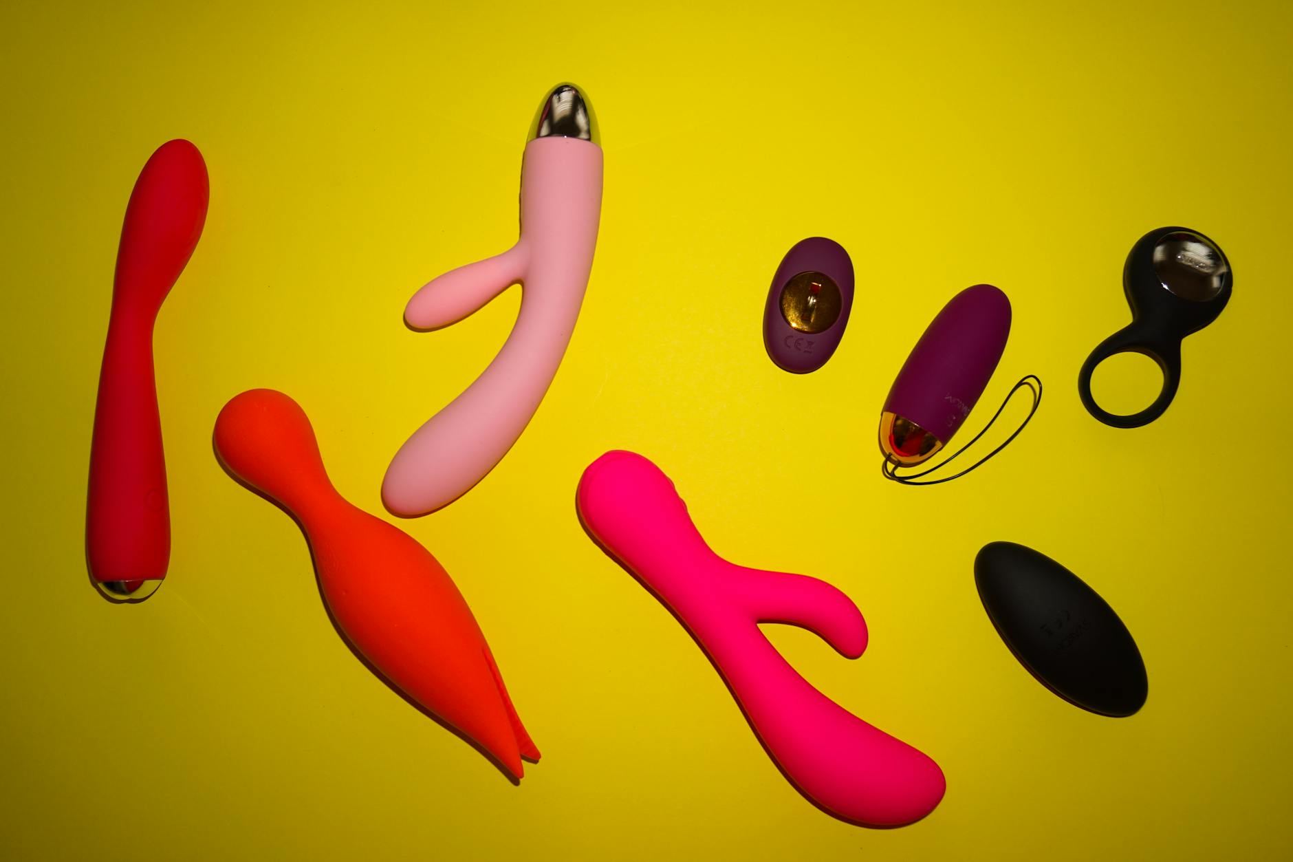 Vibrant collection of lemon clitoral vibrators on colorful background