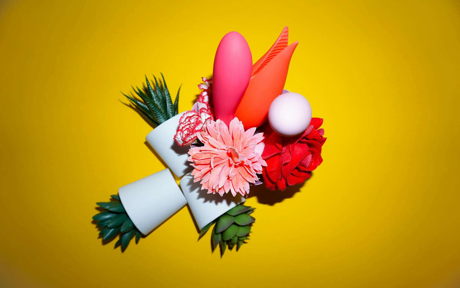 Fresh lemons on a white plate emphasizing the vibrant, citrus-forward design of lemon clitoral vibrators